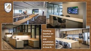 furniture and monitors being installed